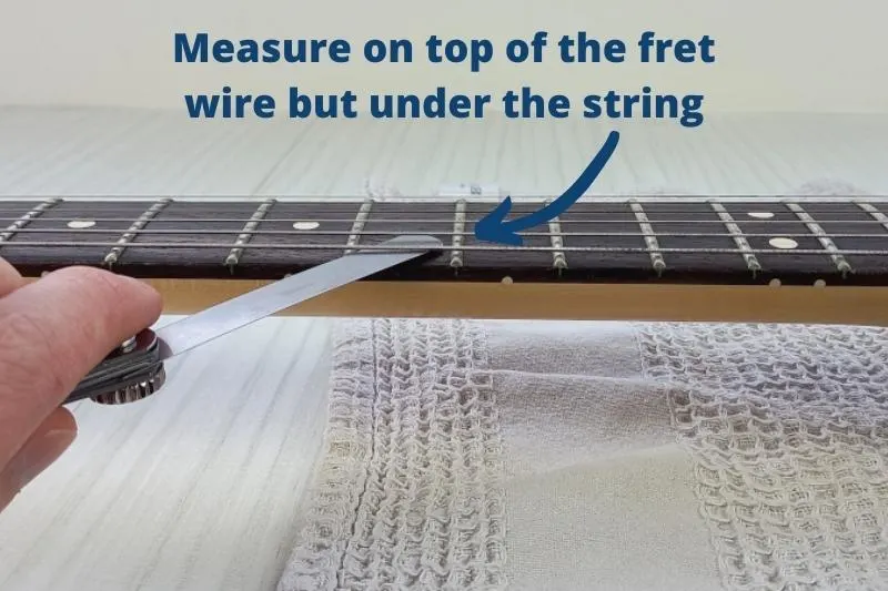 Measuring fret buzz with a feeler gauge