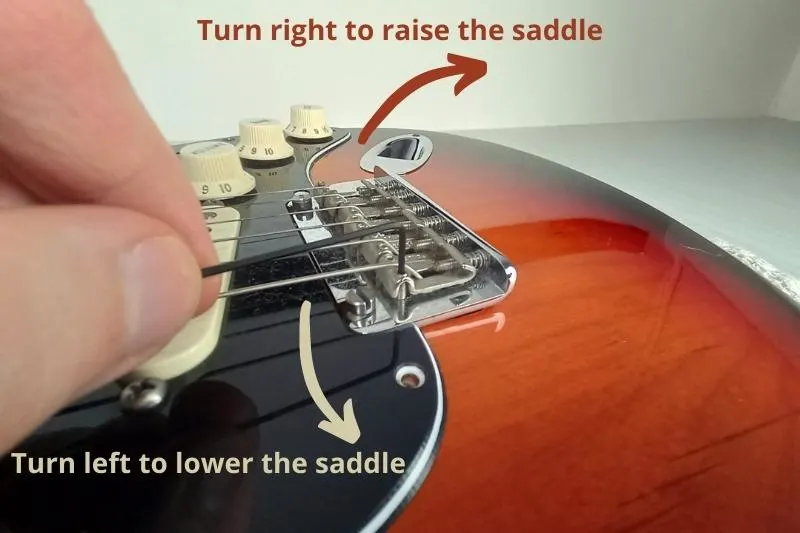 Adjusting guitar saddles