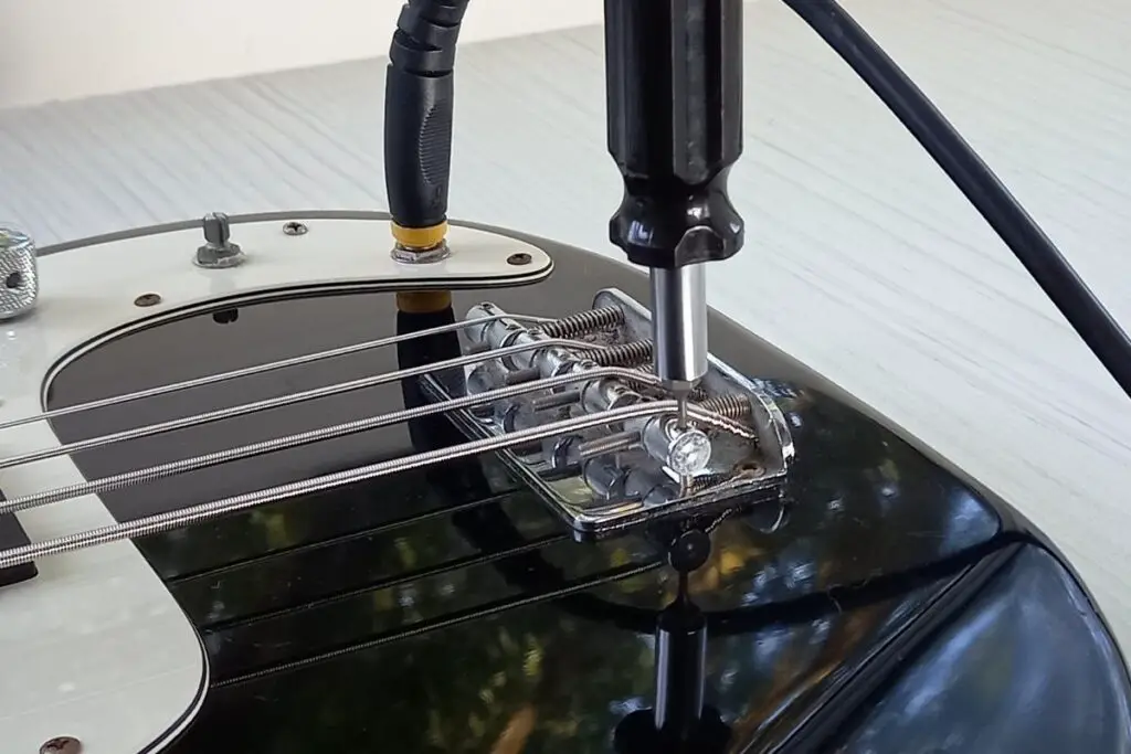 Adjusting bass bridge saddles