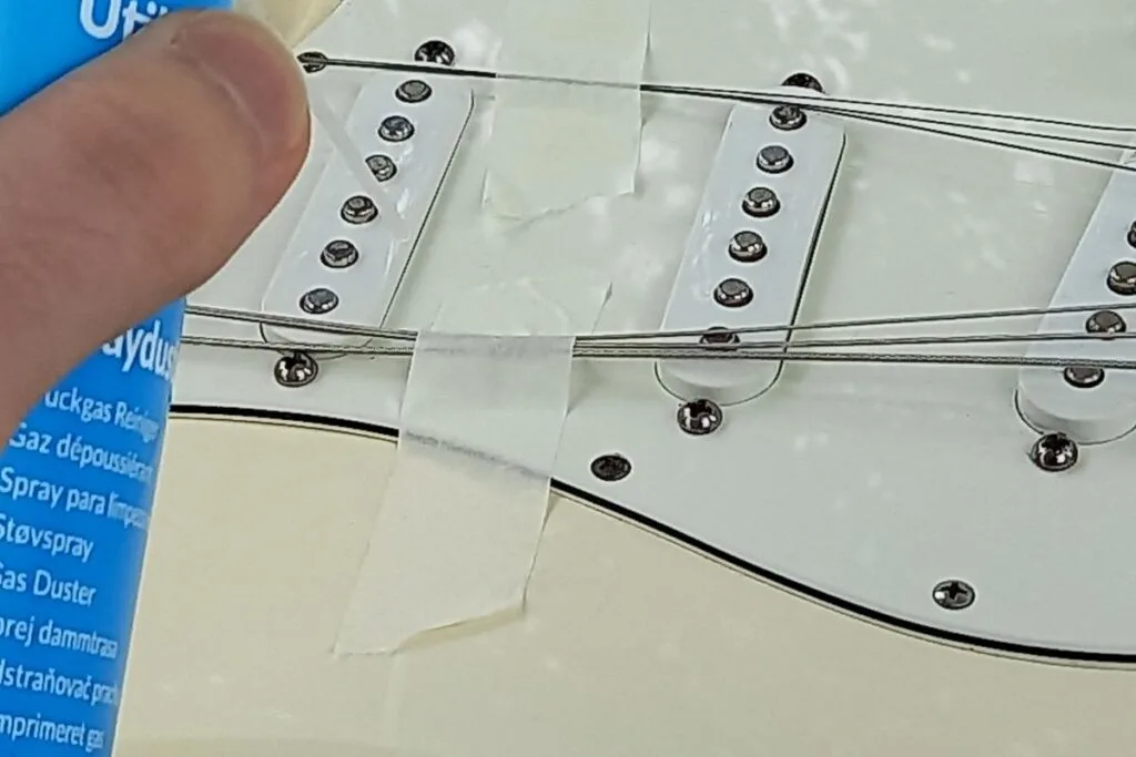 Using compressed air to clean guitar pickups