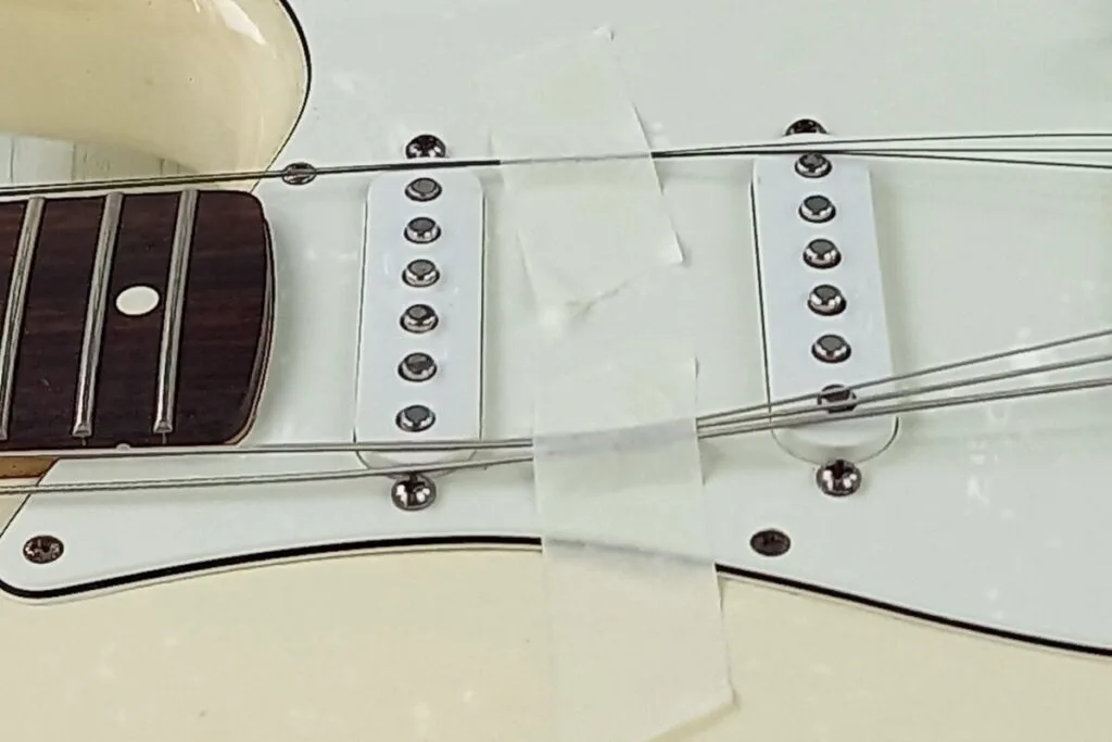 Guitar strings with tape