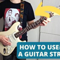 how to use a guitar strap