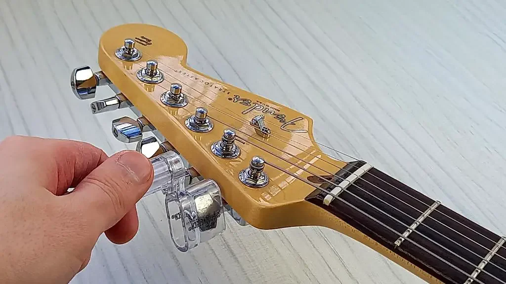 how to restring an electric guitar